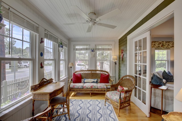 23 E Grand Ave, Scarborough, ME 04074 - sunroom / solarium with wood finished floors, french doors, wood ceiling, and ornamental molding