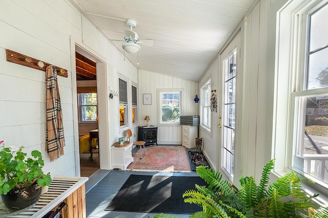82 Park Ave, Old Orchard Beach, ME 04064 - sunroom with a wood stove, lofted ceiling, french doors, and wood walls