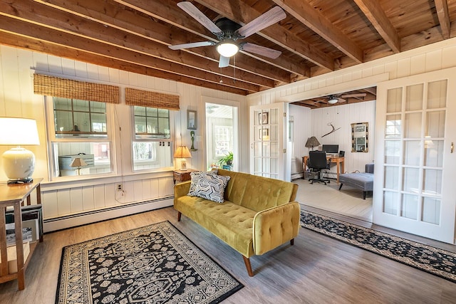 82 Park Ave, Old Orchard Beach, ME 04064 - living room featuring baseboard heating, ceiling fan, a desk, wood finished floors, and beamed ceiling