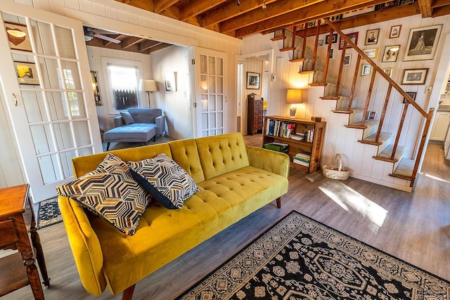 82 Park Ave, Old Orchard Beach, ME 04064 - living room with wood finished floors, stairway, ceiling fan, wooden walls, and beam ceiling