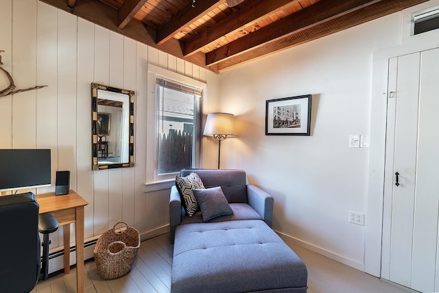 82 Park Ave, Old Orchard Beach, ME 04064 - living area with a wooden ceiling with exposed beams, a baseboard radiator, and wood finished floors