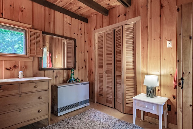 34 Alpine Shores Rd, Woodstock, ME 04219 - bedroom featuring wooden walls, a closet, and a wooden ceiling with exposed beams
