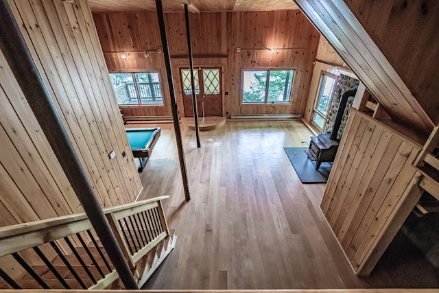 34 Alpine Shores Rd, Woodstock, ME 04219 - bonus room with a wood stove, wooden walls, wooden ceiling, wood-type flooring, and baseboard heating