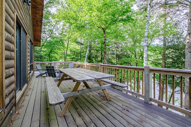 34 Alpine Shores Rd, Woodstock, ME 04219 - deck with outdoor dining area, a water view, and view of scattered trees