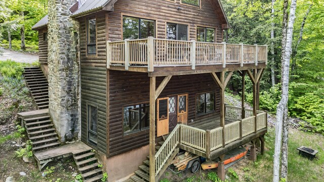 34 Alpine Shores Rd, Woodstock, ME 04219 - back of property with stairs, faux log siding, and a metal roof