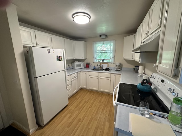 37 Cortland Cir Unit 37, Bangor, ME 04401 - kitchen with white appliances, under cabinet range hood, light wood finished floors, and white cabinets