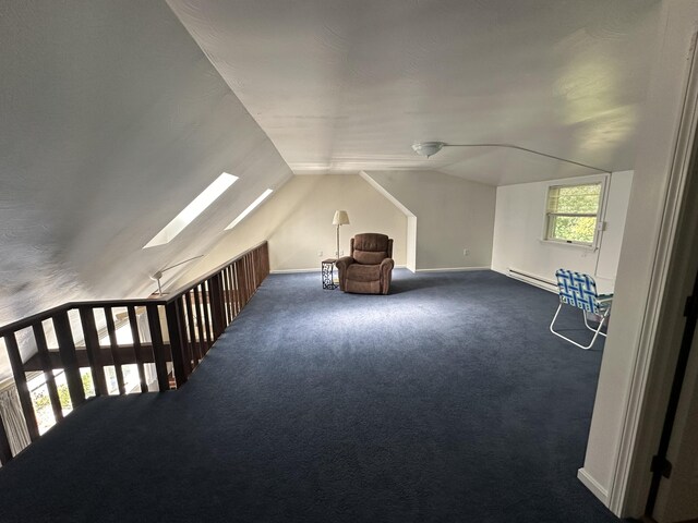 37 Cortland Cir Unit 37, Bangor, ME 04401 - bonus room with vaulted ceiling, carpet, a skylight, and a baseboard heating unit