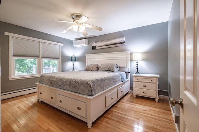11 Dana Ave, Auburn, ME 04210 - bedroom with baseboard heating, a wall mounted air conditioner, light wood-style floors, and ceiling fan