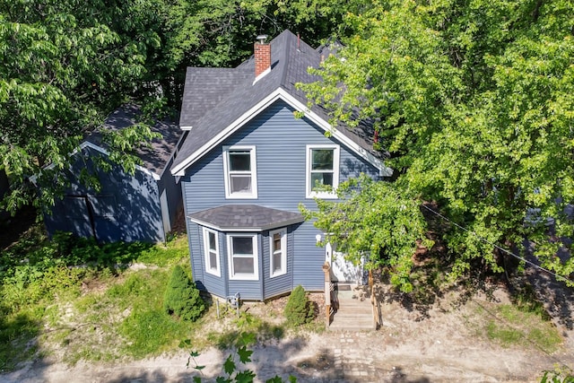 62 Seventh St, Auburn, ME 04210 - view of front facade with roof with shingles and a chimney