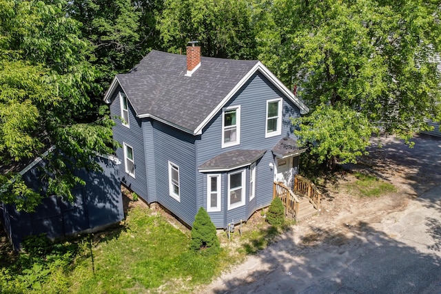 62 Seventh St, Auburn, ME 04210 - view of front of home with a shingled roof and a chimney
