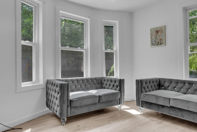 62 Seventh St, Auburn, ME 04210 - sitting room with wood finished floors and baseboards