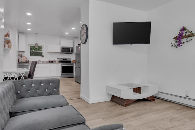 62 Seventh St, Auburn, ME 04210 - living area featuring light wood-style flooring and recessed lighting