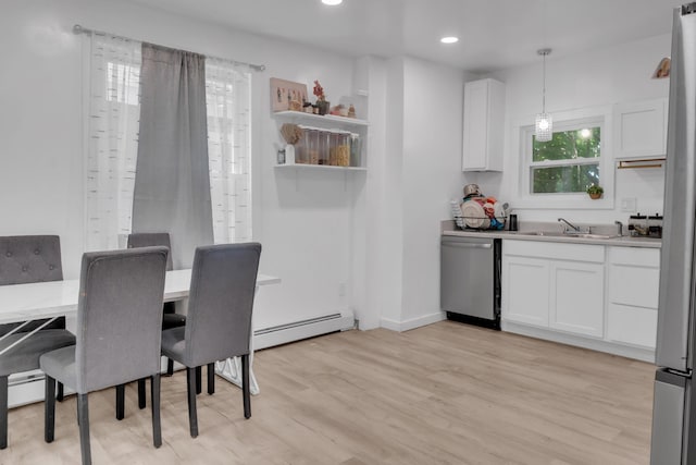 62 Seventh St, Auburn, ME 04210 - kitchen with appliances with stainless steel finishes, a baseboard radiator, white cabinetry, light wood-type flooring, and recessed lighting