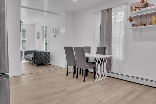 62 Seventh St, Auburn, ME 04210 - dining space featuring wood finished floors and a baseboard heating unit