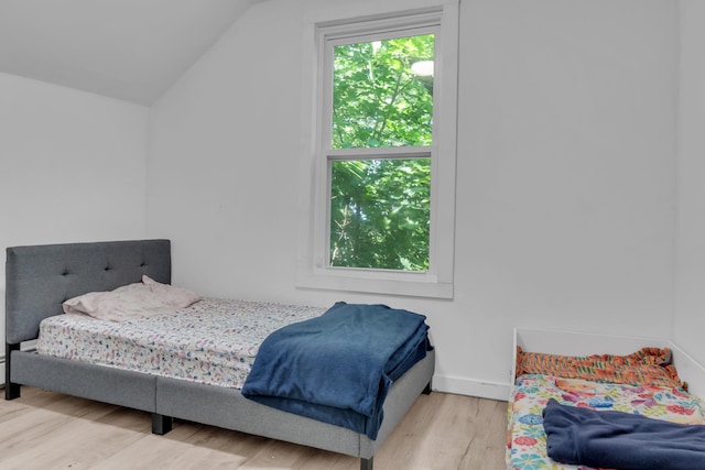 62 Seventh St, Auburn, ME 04210 - bedroom featuring wood finished floors and lofted ceiling