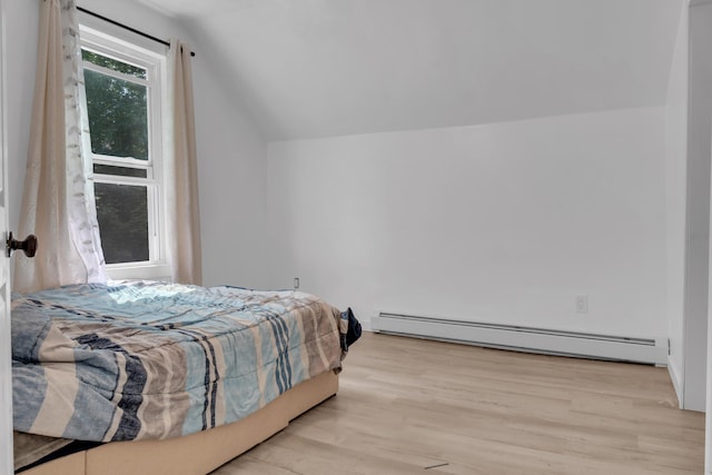 62 Seventh St, Auburn, ME 04210 - bedroom with a baseboard heating unit, lofted ceiling, and wood finished floors