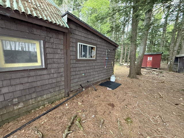 23 Webber Is, Sebec, ME 04481 - view of side of property with a metal roof and a shed