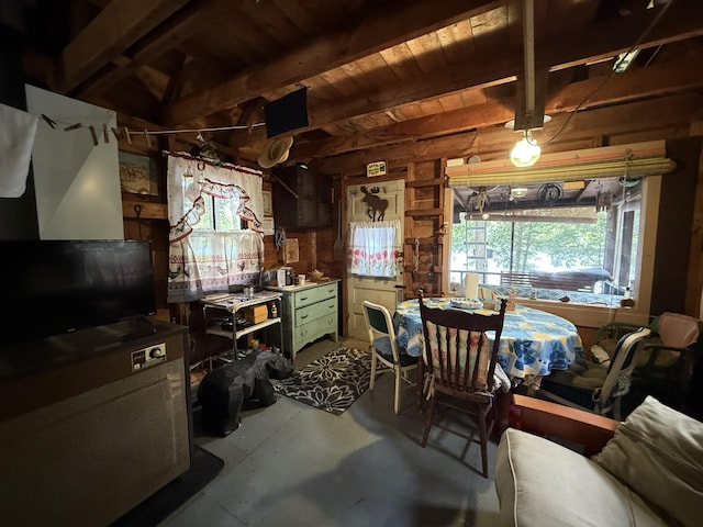 23 Webber Is, Sebec, ME 04481 - kitchen with wooden walls, concrete flooring, and a wood ceiling with exposed beams