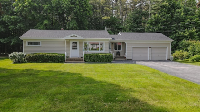 12 Davis Dr, Veazie, ME 04401 - ranch-style house with a garage, driveway, entry steps, and a front lawn