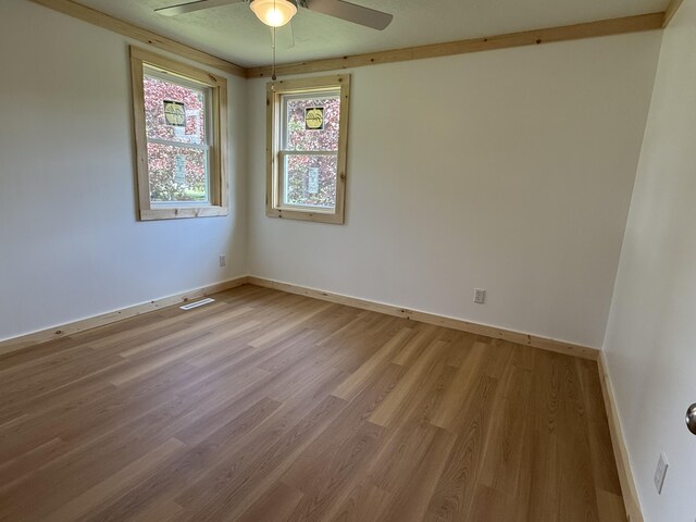 788 Access Hwy, Caribou, ME 04736 - empty room with ceiling fan and light wood finished floors