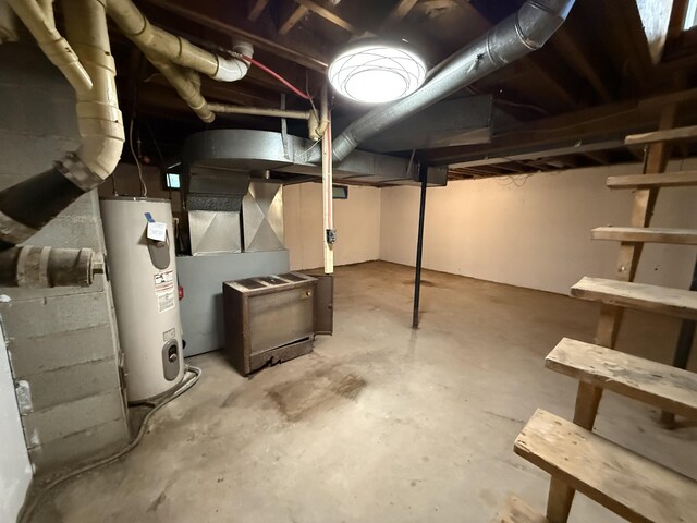 788 Access Hwy, Caribou, ME 04736 - unfinished basement with electric water heater and heating unit