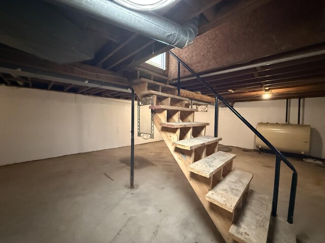 788 Access Hwy, Caribou, ME 04736 - unfinished basement featuring heating fuel and stairs