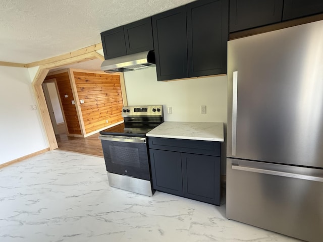 788 Access Hwy, Caribou, ME 04736 - kitchen featuring stainless steel appliances, ventilation hood, light marble finish flooring, wood walls, and light stone countertops