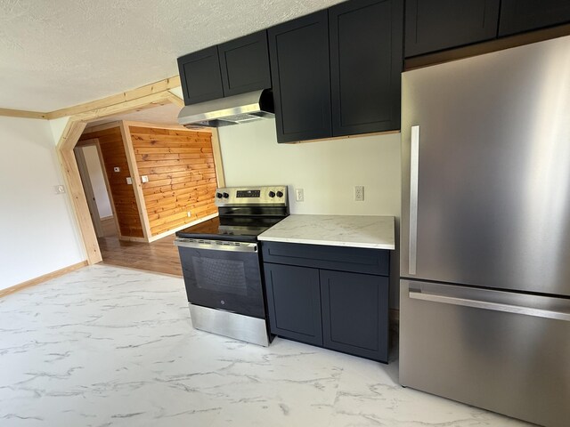788 Access Hwy, Caribou, ME 04736 - kitchen featuring stainless steel appliances, ventilation hood, light marble finish flooring, wood walls, and light stone countertops