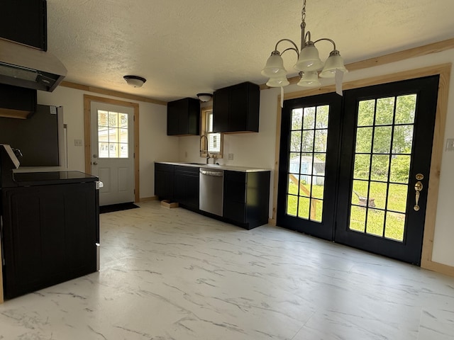 788 Access Hwy, Caribou, ME 04736 - kitchen featuring appliances with stainless steel finishes, dark cabinetry, a chandelier, light marble finish flooring, and a textured ceiling
