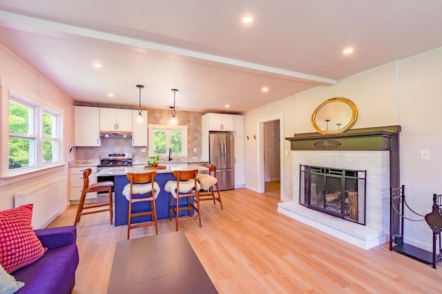 221 Lincolnville Ave, Belfast, ME 04915 - kitchen featuring stainless steel appliances, white cabinets, healthy amount of natural light, a kitchen island, and recessed lighting