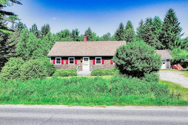 221 Lincolnville Ave, Belfast, ME 04915 - view of front of home featuring a chimney, a garage, and driveway