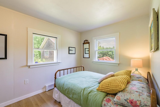 221 Lincolnville Ave, Belfast, ME 04915 - bedroom with wood finished floors and baseboard heating