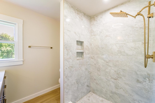 221 Lincolnville Ave, Belfast, ME 04915 - bathroom featuring tiled shower and wood finished floors