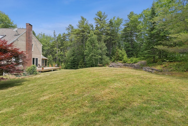 27 Libby Ln, Brunswick, ME 04011 - view of grassy yard featuring a deck and a view of trees