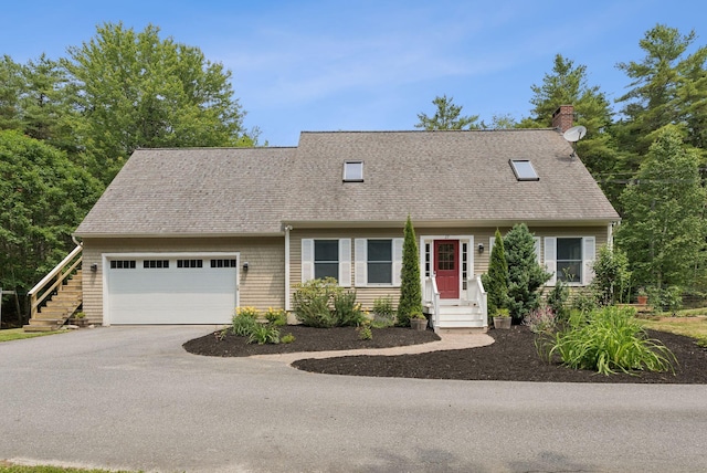 27 Libby Ln, Brunswick, ME 04011 - cape cod-style house with a chimney, asphalt driveway, an attached garage, and roof with shingles