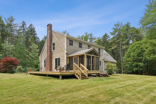 27 Libby Ln, Brunswick, ME 04011 - rear view of house featuring a sunroom, a chimney, a yard, and a wooden deck