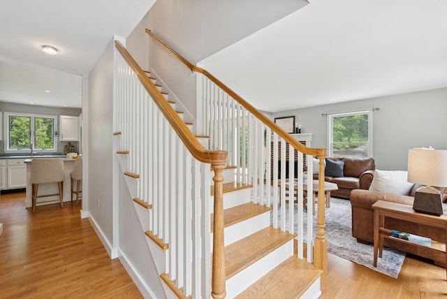 27 Libby Ln, Brunswick, ME 04011 - stairs with healthy amount of natural light and wood finished floors