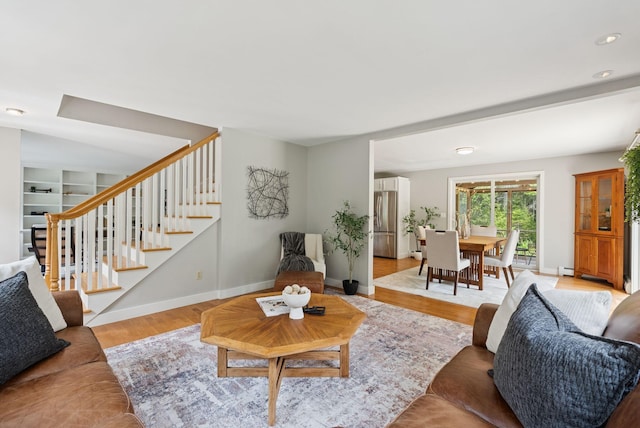 27 Libby Ln, Brunswick, ME 04011 - living area with light wood finished floors, stairs, recessed lighting, and baseboard heating