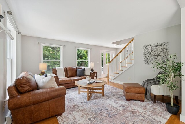 27 Libby Ln, Brunswick, ME 04011 - living area featuring wood finished floors, stairs, and a baseboard radiator