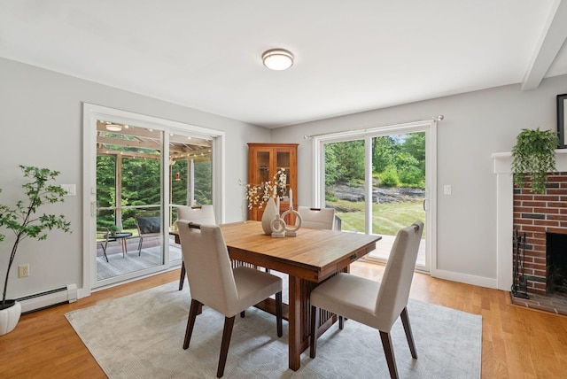 27 Libby Ln, Brunswick, ME 04011 - dining room with light wood-style flooring and a brick fireplace