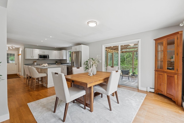 27 Libby Ln, Brunswick, ME 04011 - dining area featuring a baseboard heating unit, light wood-type flooring, and recessed lighting