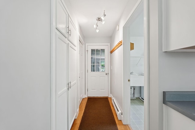 27 Libby Ln, Brunswick, ME 04011 - entryway with a baseboard radiator and light wood-type flooring