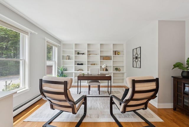 27 Libby Ln, Brunswick, ME 04011 - office space featuring a baseboard radiator, wood finished floors, and built in features