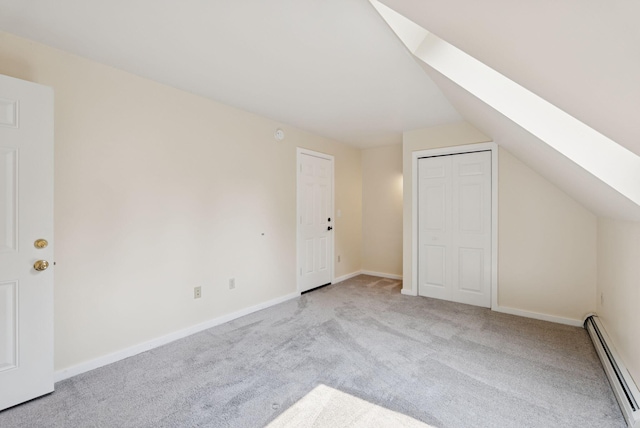 27 Libby Ln, Brunswick, ME 04011 - additional living space with baseboard heating, a skylight, carpet, and vaulted ceiling