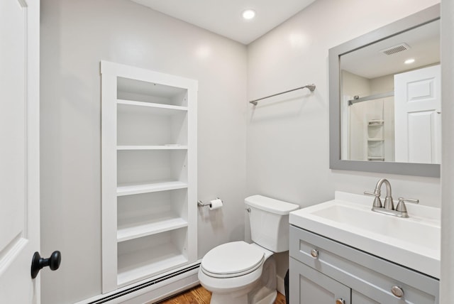 27 Libby Ln, Brunswick, ME 04011 - full bath featuring a baseboard heating unit, vanity, a shower, and wood finished floors