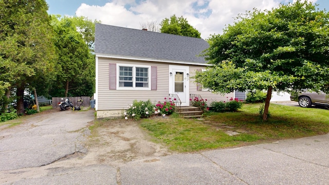 5 Wilson St, Lewiston, ME 04240 - view of front facade with a shingled roof