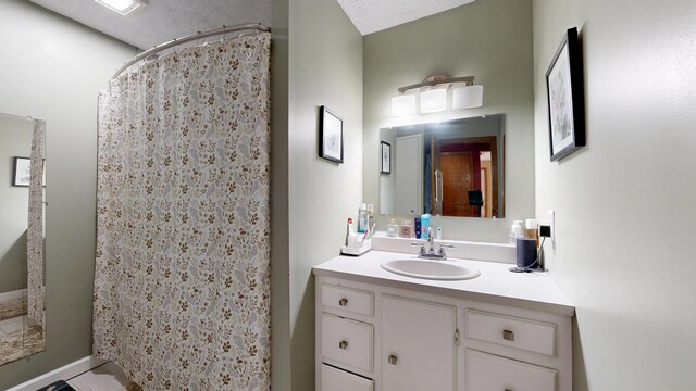 5 Wilson St, Lewiston, ME 04240 - full bathroom featuring vanity and a shower with shower curtain