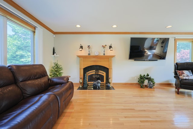 6 Grande Ave, Lewiston, ME 04240 - living area featuring wood finished floors, a fireplace, recessed lighting, and ornamental molding