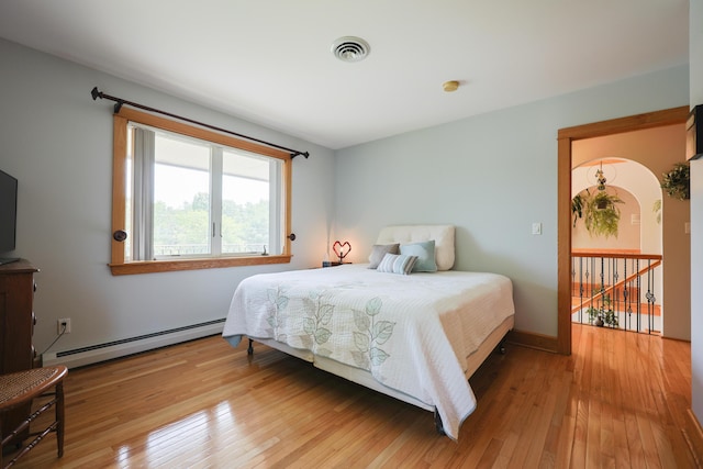 6 Grande Ave, Lewiston, ME 04240 - bedroom with a baseboard radiator and hardwood / wood-style flooring