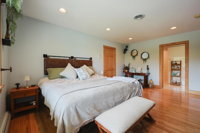 6 Grande Ave, Lewiston, ME 04240 - bedroom with baseboard heating, wood finished floors, and recessed lighting